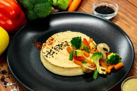 Hummus with vegetables Stock Photos