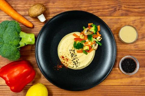 Hummus with vegetables Stock Photos