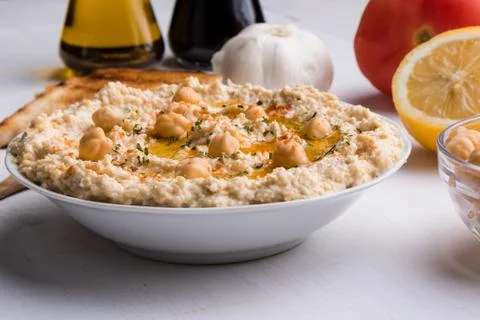 Hummus on white table Stock Photos