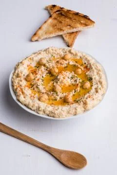Hummus on white table Stock Photos