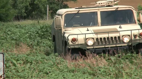 Hummvee driving 2PR Stock Footage 11308189
