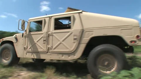 Hummvee driving 3PR Stock Footage 11316867