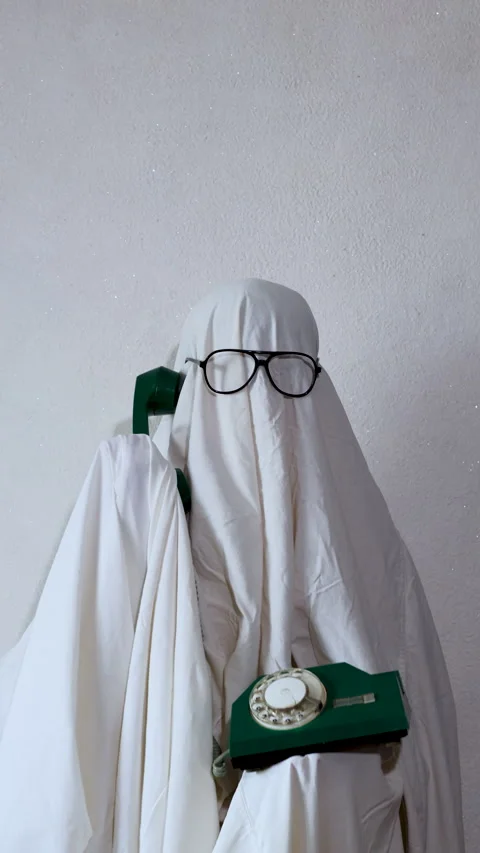 A humorous scene featuring a person dressed as a ghost with a white sheet a.. Stock Footage 314747574