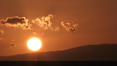 Humpback Whale Spouting In The Distance At Sunset Video stock 106522367