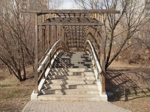 The humpbacked bridge thrown through small river in old park. Stock-Fotos