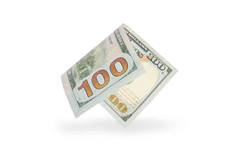 Hundred dollar bill falling casting shadow, half-folded bill close-up on white Stock Photos