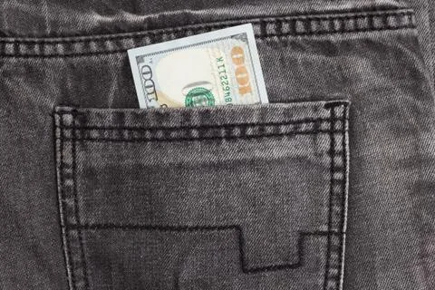 Hundred dollar bill inside back pocket jeans Stock Photos