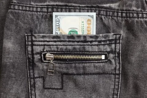 Hundred dollar bill inside back pocket jeans Foto stock