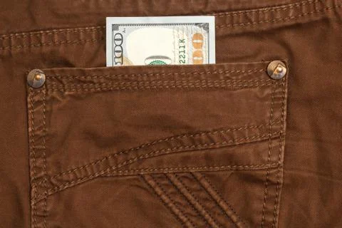 Hundred dollar bill inside back pocket jeans Stock Photos