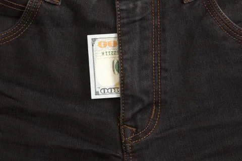 Hundred dollar bill inside  codpiece black jeans Stock Photos
