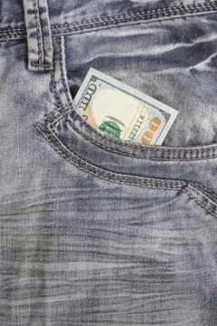 Hundred dollar bill inside front pocket jeans Stock Photos
