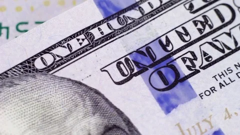 A hundred-dollar bill to spin under the microscope, watermarks closeup Stock Footage 81043614