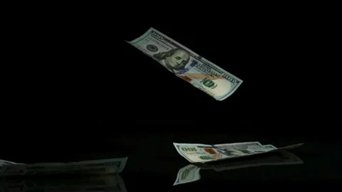 Hundred dollar bills falling on black surface Stock Footage 327052215