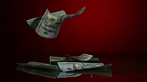 Hundred dollar bills falling on red surface Stock Footage 327120507