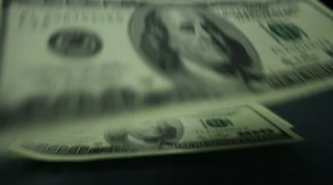 Hundred dollar bills spread out on the table in slow motion Stock Footage 61533957