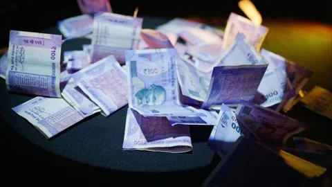 Hundred rupee notes spread loosely reflect wealth Stock Footage 313670184