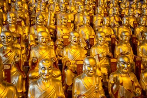 Hundred of statues of Buddha Stock Photos