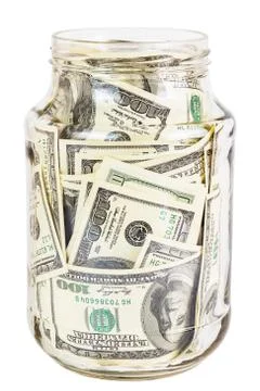 A hundred US dollars bank notes in a glass jar isolated on white background Photos