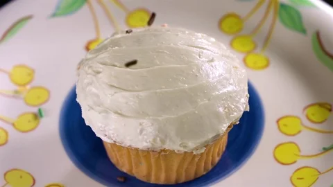 Hundreds and thousands falling on cupcake in slow motion Stock Footage 71210052