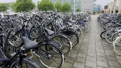 Hundreds of bicycles are parked at Eindhoven train station lot Stock-Footage 335946514
