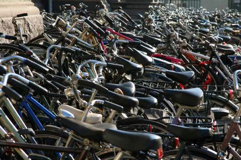 Hundreds of bikes on sidewalk Stock Photos