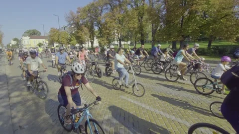 Hundreds of cyclists are taking part in a bicycle parade along a boulevard Stock-Footage 346375641