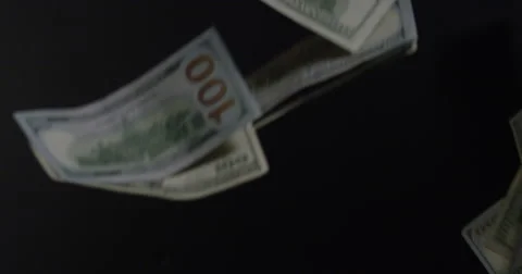 Hundreds Isolated On Black falling through the air Stock Footage 64936585