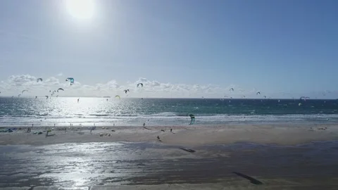 Hundreds of kiters in the ocean and on the beach Stock Footage 231031742