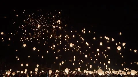 Hundreds of Lanterns Released by Crowd at Night During Light Up Winter Festival Stock Footage 346450908