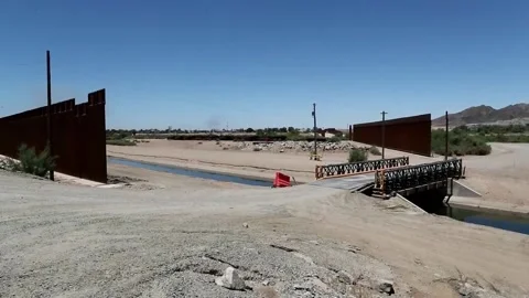 Hundreds of migrants cross the border between Mexico and the United States in Yu Stock Footage 204150822