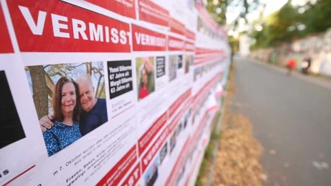 Hundreds of missing Israeli Hamas victims are pasted on a fence with posters, Be Stock Footage 253319884