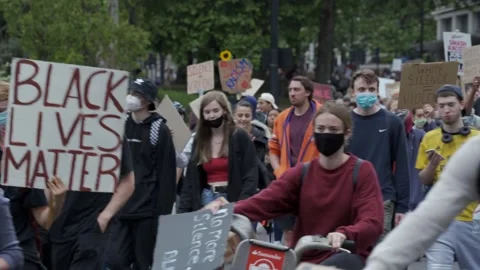 Hundreds of multicultural Black lives Matter protesters marching down Stock Footage 131996836
