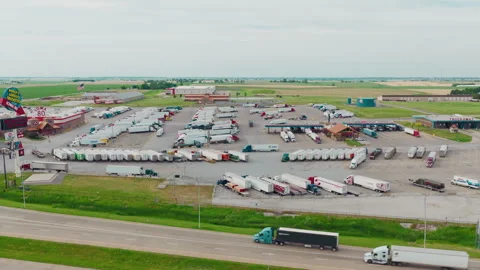 Hundreds of Parked Semi-Trucks at a Massive Heartland Freight Plaza at the Stock Footage 337445638