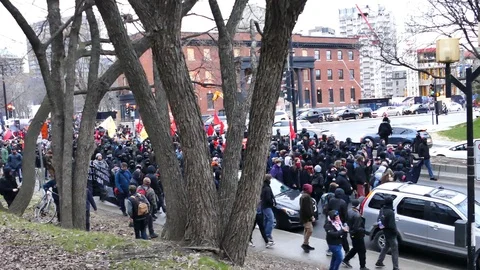Hundreds of people protesting in the street Stock Footage 114688895