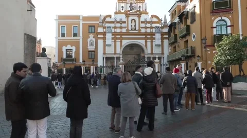 Hundreds queue outside Seville parish to kiss La Macarena's hand, Seville, ES -  Video stock 324093620