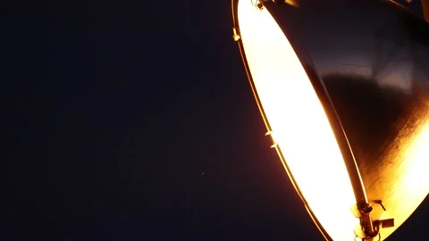 Hundreds of tiny flying bugs near an outdoor lamp at night Stock Footage 159722414