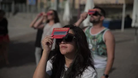 Hundreds watch partial solar eclipse from several Spanish cities, Puerto del Ros Stock Footage 305325693