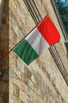 Hungarian flag mounted on the wall evolving in the wind 写真素材