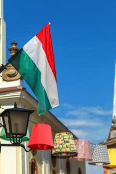 Hungarian flag mounted on the wall evolving in the wind 写真素材