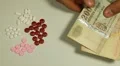 Hungarian Forint HUF, Counting Drugs and Money, Health Care, Colorful Pills HD Footage