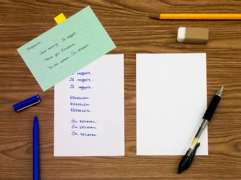 Hungarian; Learning New Language Writing Words on the Notebook Stock Photos