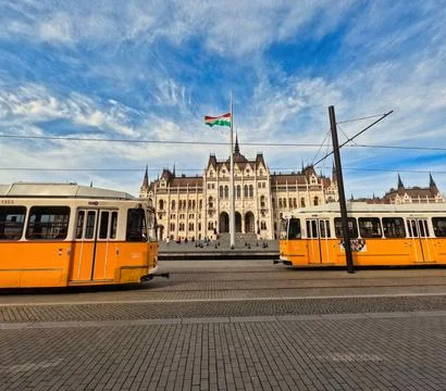 Hungarian Parliament Building with Passing Trams Stock Photos