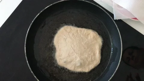 A Hungarian specialty, a deep fried flat bread made of potato-based dough Stock Footage 132585645