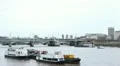 Hungerford Bridge and Golden Jubilee Bridge in London, England, Thames River HD Footage
