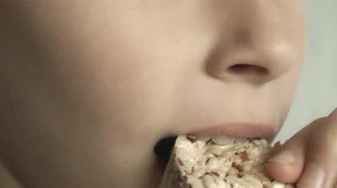 Hungry boy with appetite eats cookies Stock Footage 68434520