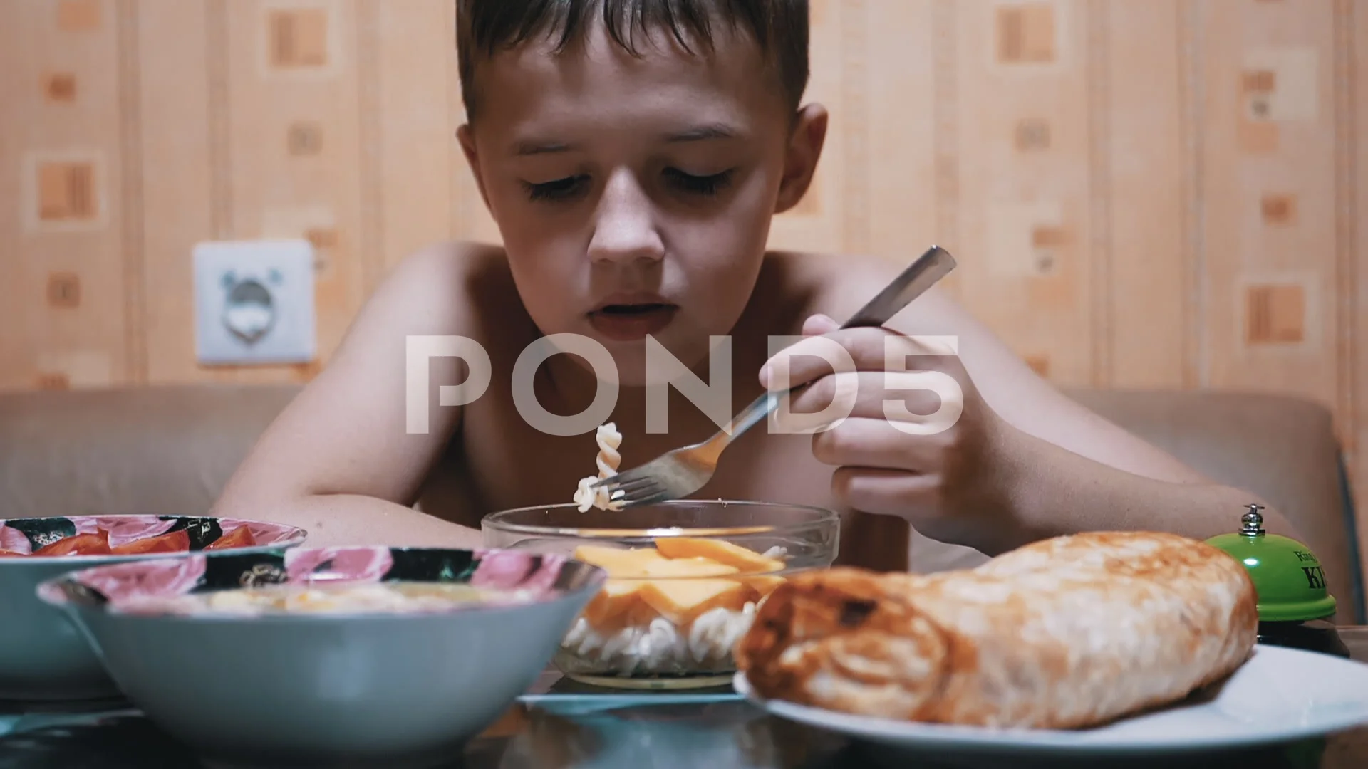 Hungry Child Eats Pasta with a Fork. Hom... | Stock Video | Pond5