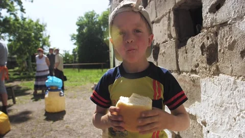 Hungry children's hands with a bread. Stock Footage 132747092