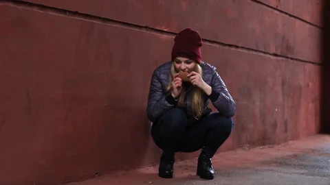 Hungry girl eats bread Stock Footage 97219543