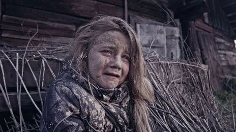 A hungry homeless child cries. War. Refugees Stock Footage 76993473