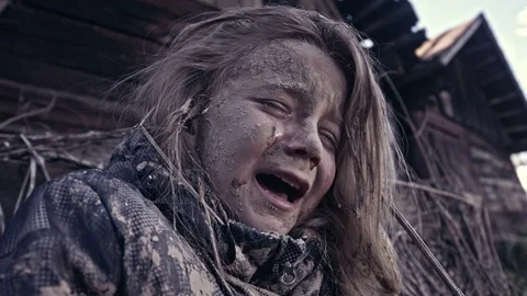 A hungry homeless child cries. War. Refugees Stock Footage